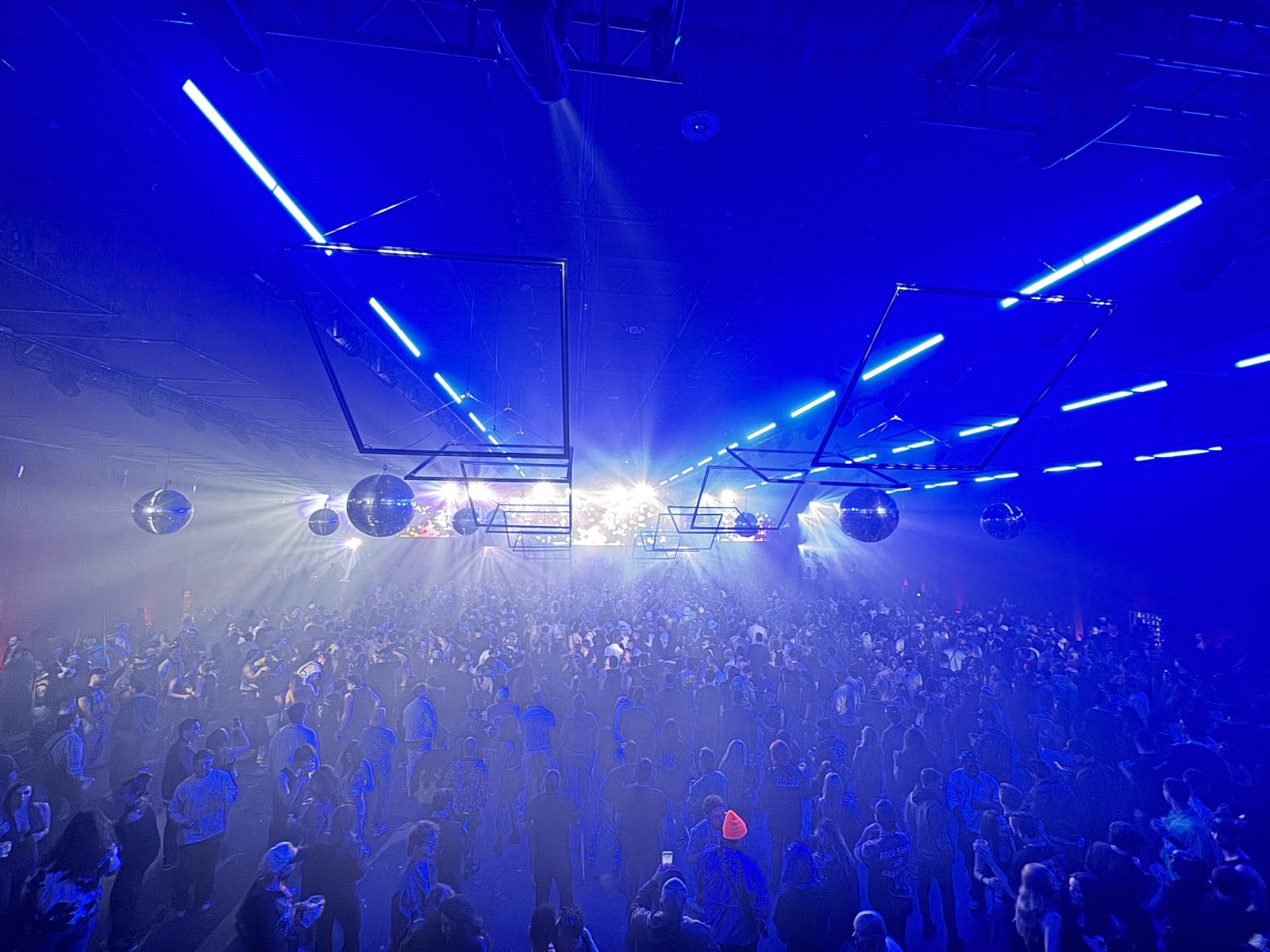 The RE:FRAME crowd under a canopy of moving kinetic light squares