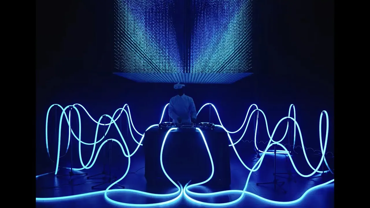 Custom DJ stage — light tubes and kinetic rings
