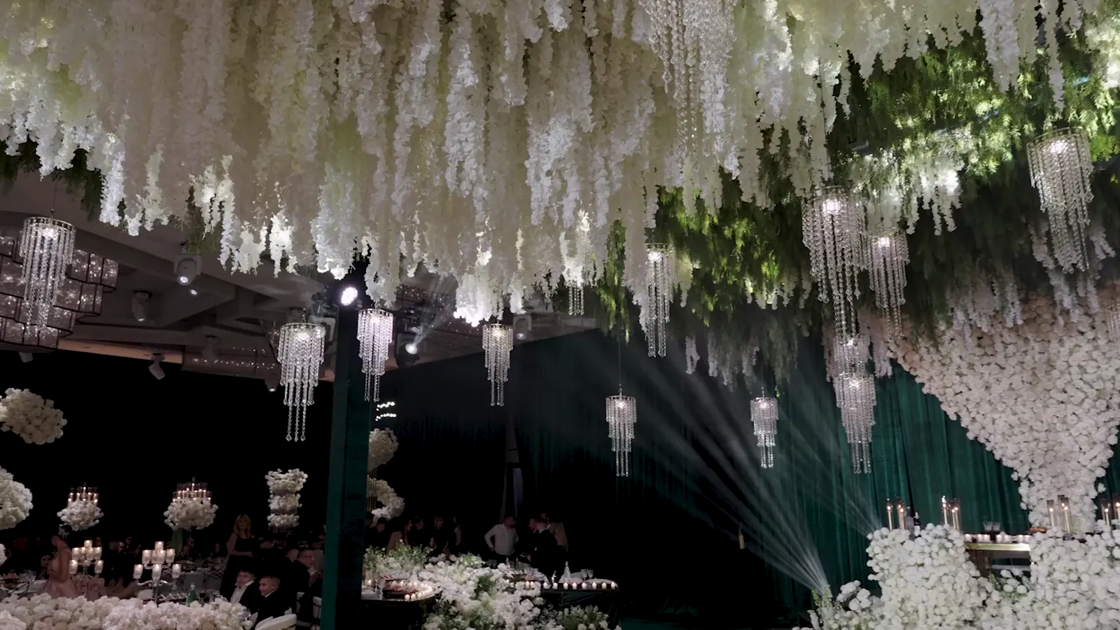 Kinetic LED elements suspended over an event floor