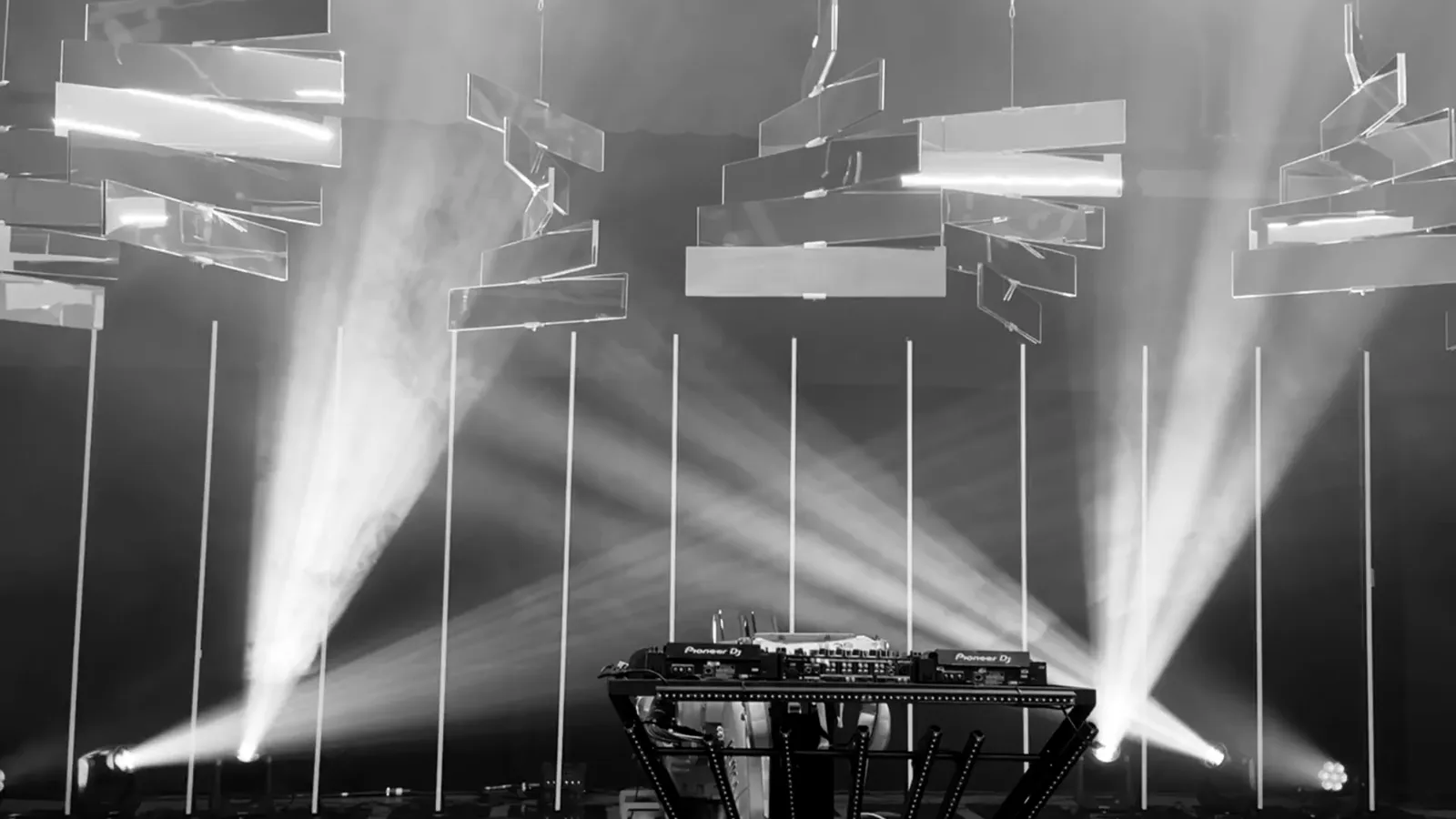 Kinetic mirror boards throwing laser beams across a venue