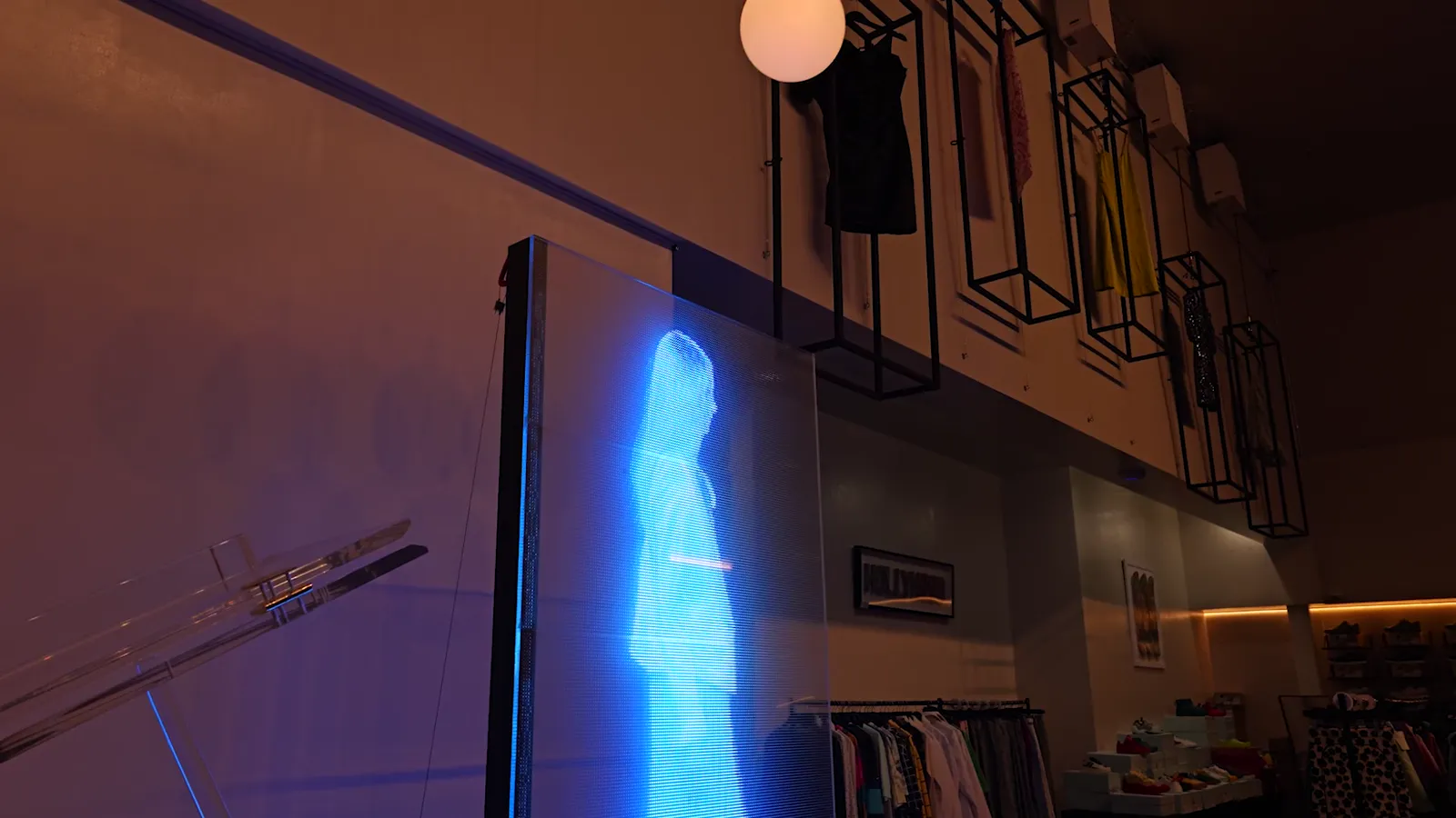 Transparent LED screens with cars visible behind them