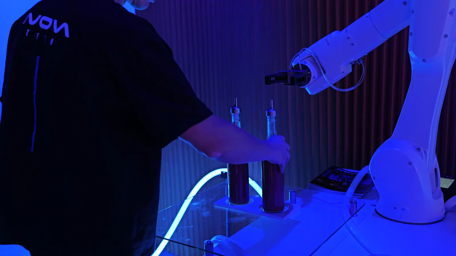 The NovaTech robot bartender pouring for a Las Vegas crowd