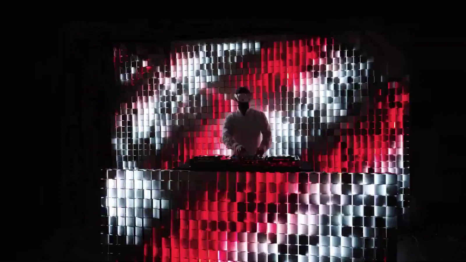 Flip Brick DJ stand with a kinetic wall behind the DJ
