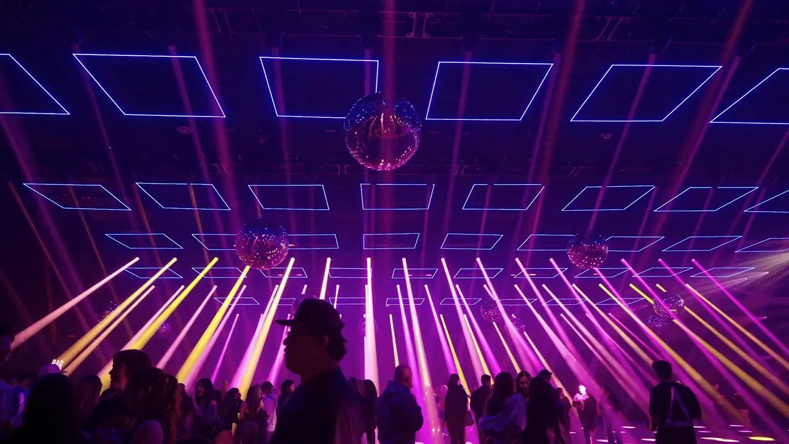 Kinetic LED elements suspended over an event floor