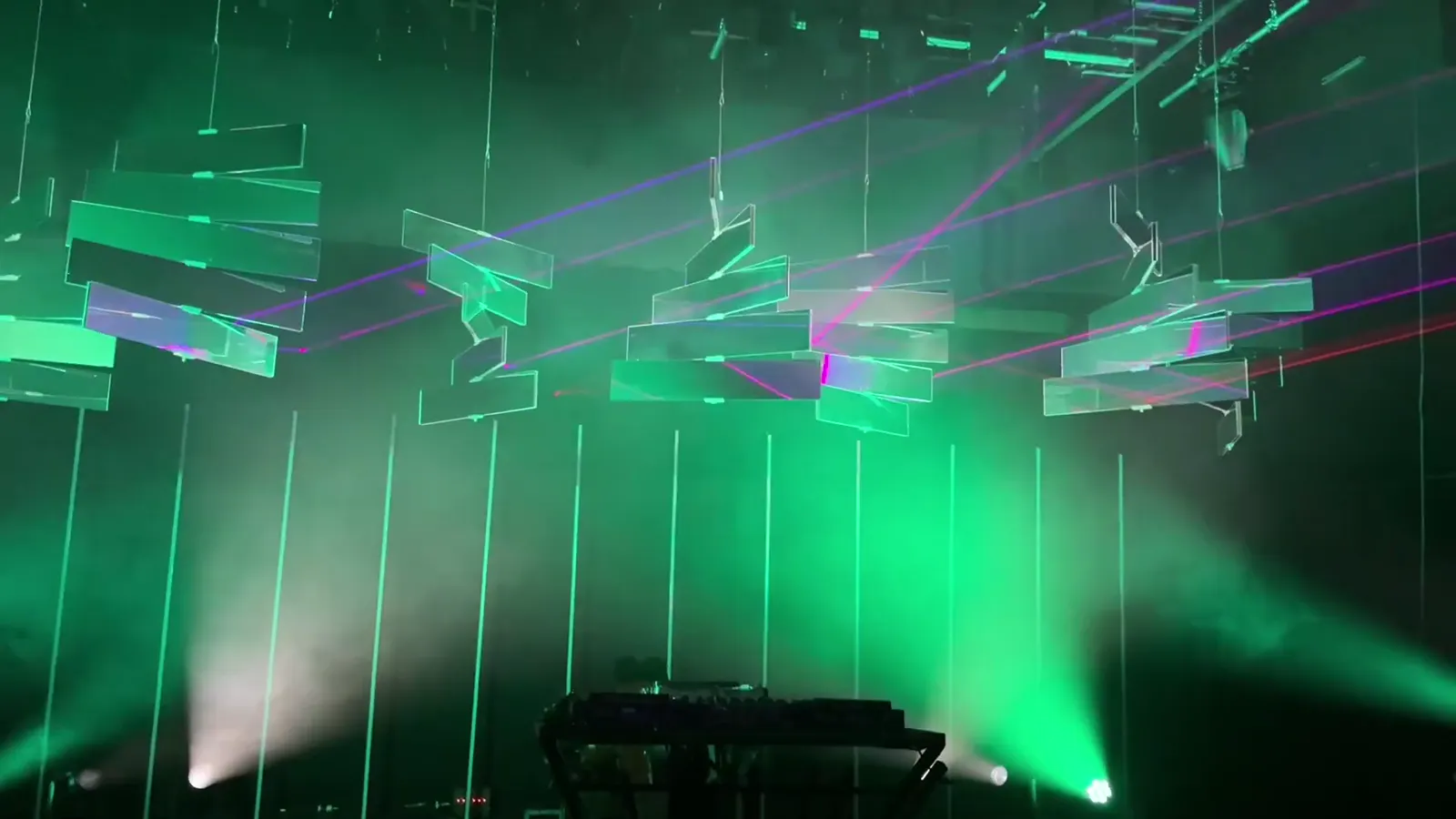 Kinetic mirror boards throwing laser beams across a venue