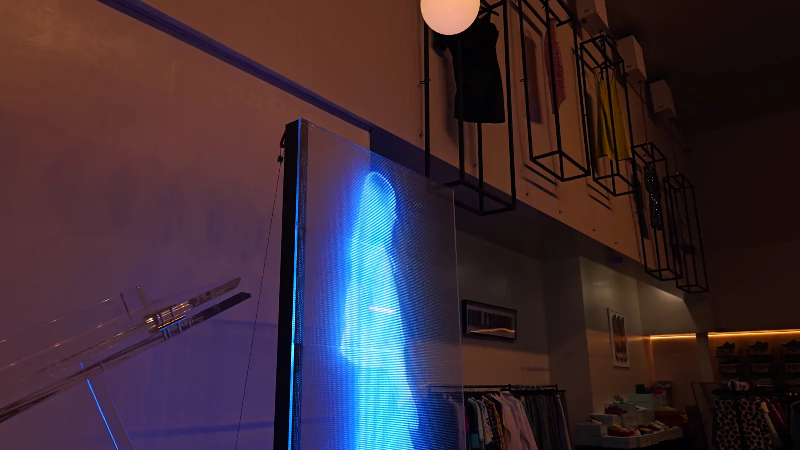 Transparent LED screens with cars visible behind them